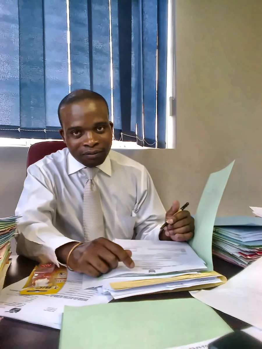 Attorney seated at a desk reviewing legal documents