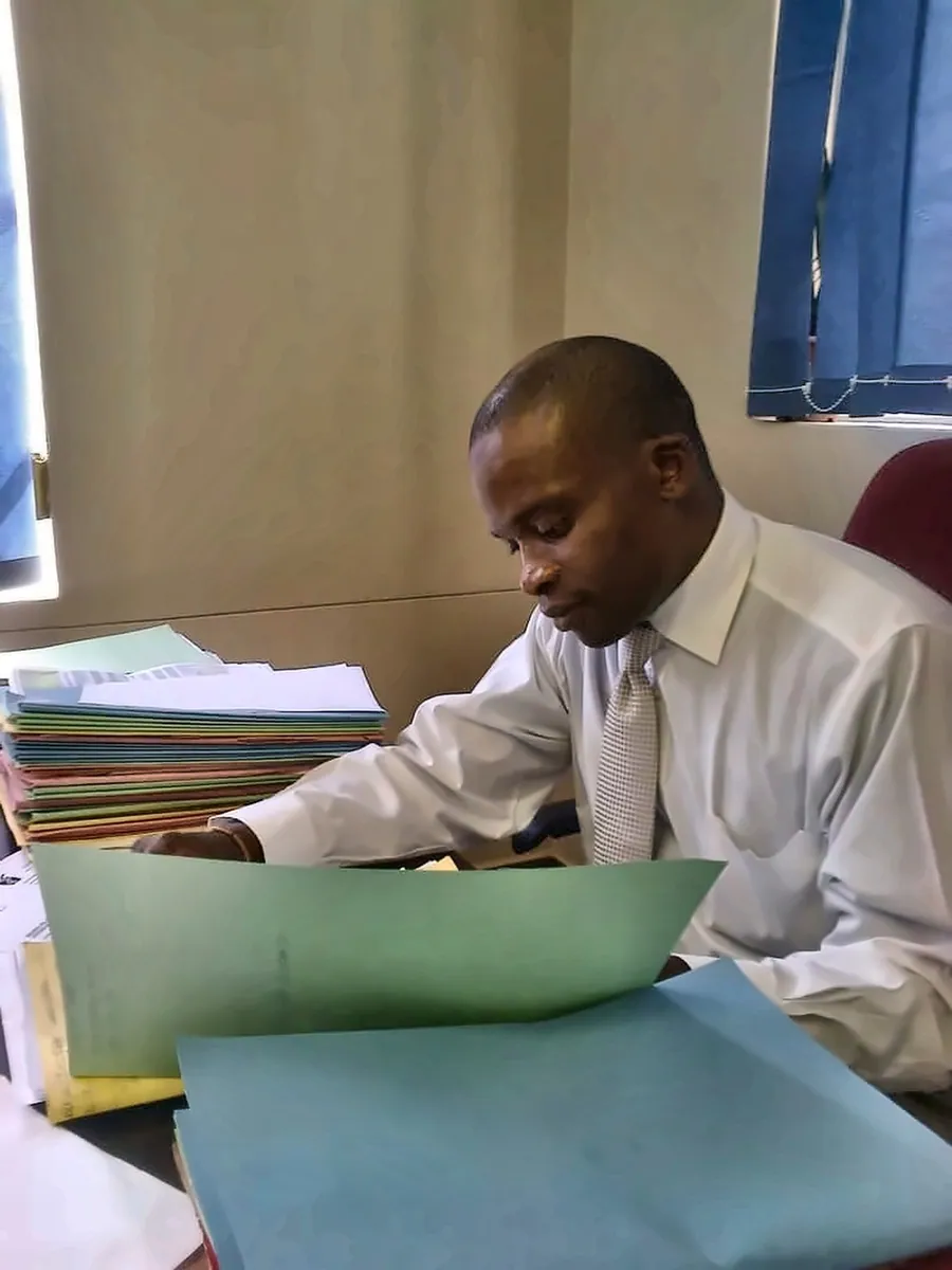 Attorney reviewing legal files at the office
